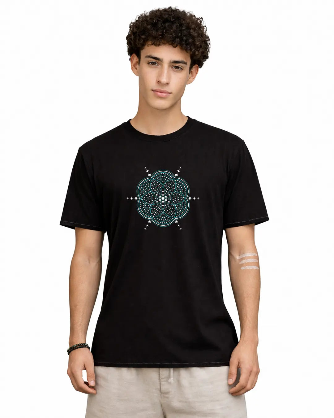 Person wearing a black t-shirt with a blue geometric design on a white background