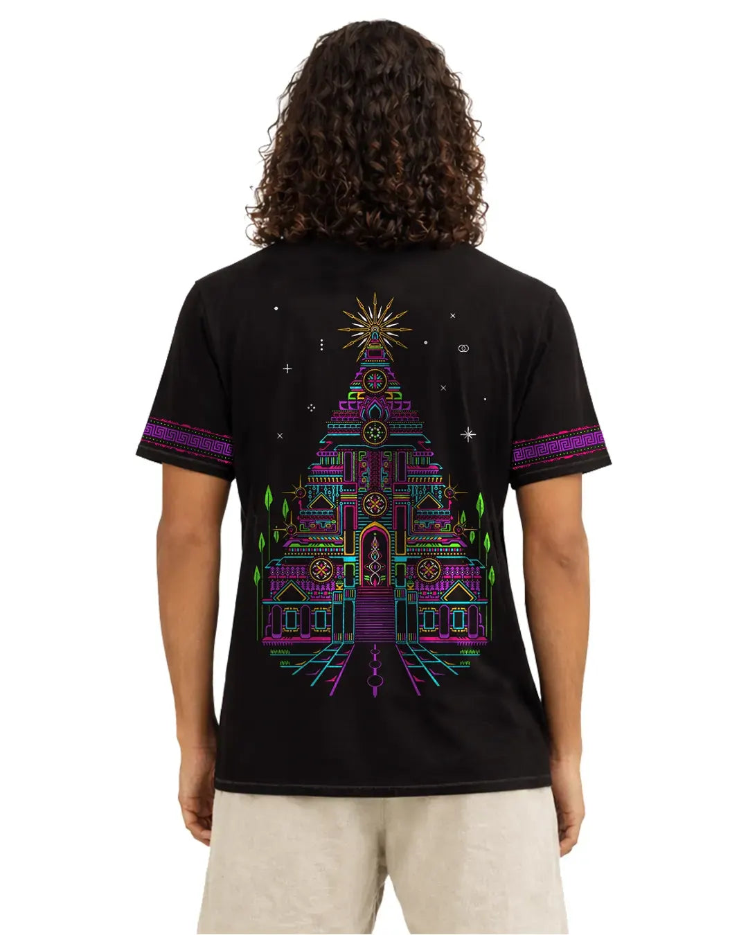 Person wearing a black t-shirt with a colorful geometric design on the back