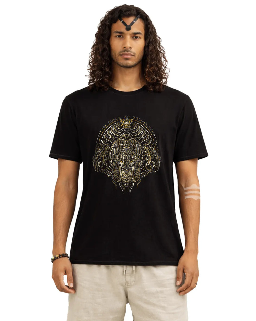 Man wearing a black t-shirt with a graphic design on a white background