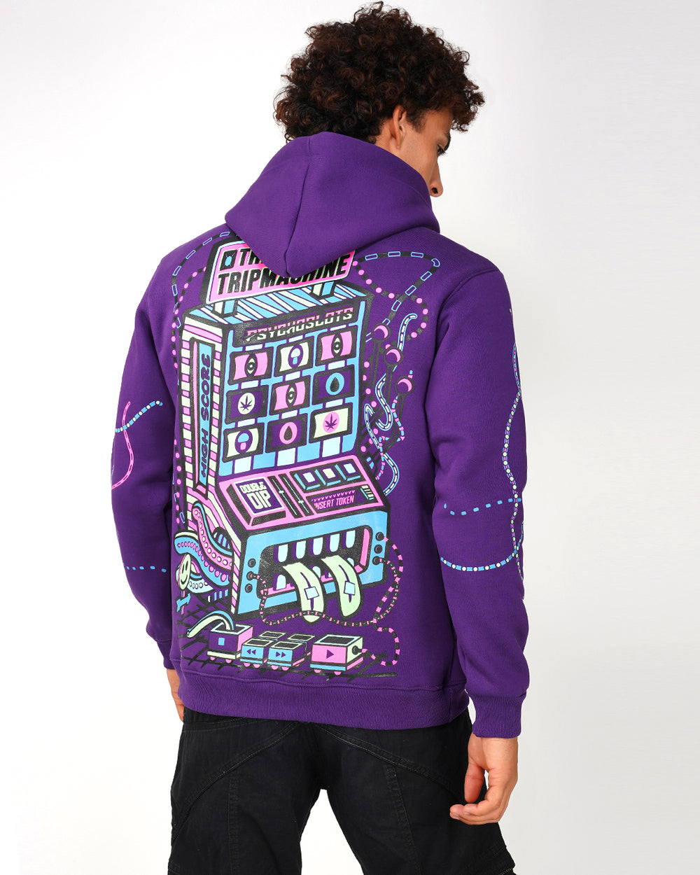 A person wearing a purple hoodie with a geometric pattern and a drawstring hood.