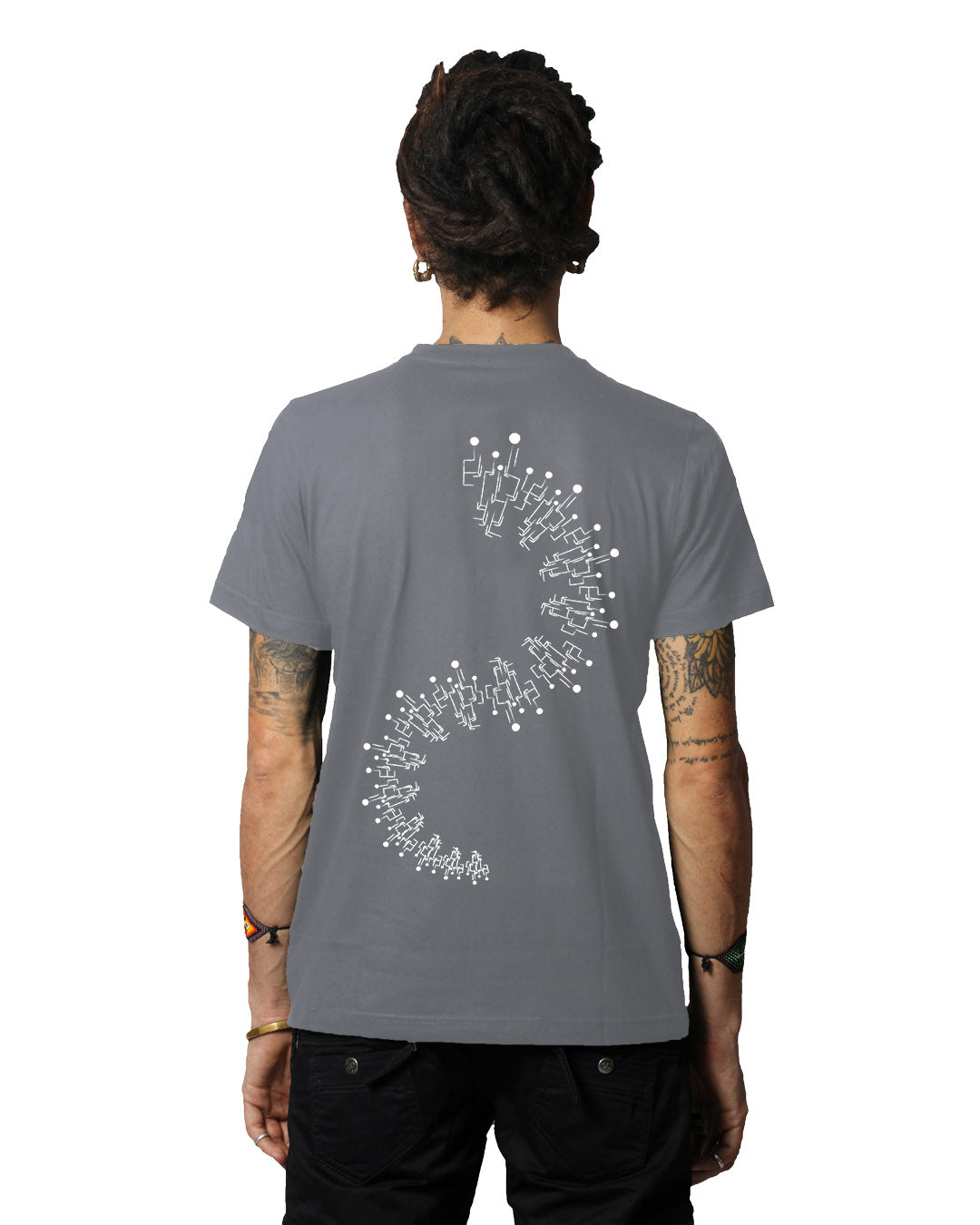 A person wearing a gray round neck half sleeve T-shirt with a glow-in-the-dark pattern on the back.