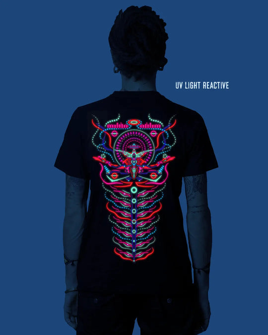 Person wearing a black t-shirt with a colorful UV light reactive design on the back against a blue background.
