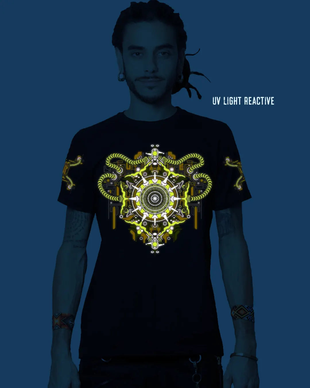 Person wearing a black t-shirt with a UV light reactive design under blue light