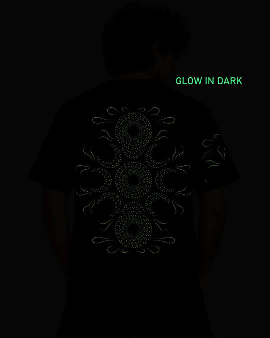 Ultra Tribe Stellar Oasis graphic glow in dark T-shirt showcasing its distinctive psychedelic artwork on a regular-fit cotton tee.