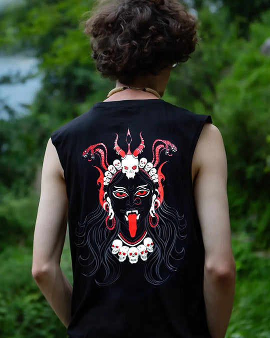 Person wearing a black sleeveless shirt with a red and white graphic design on the back, standing outdoors.