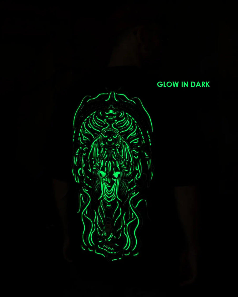 ultra tribe gow in dark and uv light reactive black oversized t-shirt with a detailed psuchedelic design the call of cthulhu design Glowing green design on a black background with 'Glow in Dark' text.