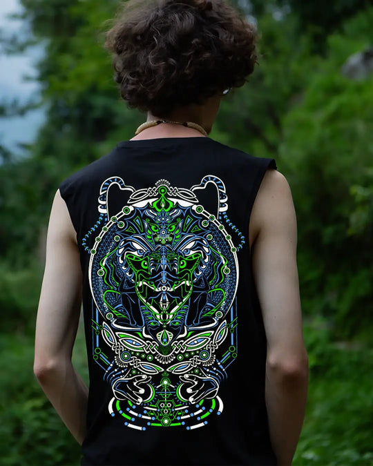 Person wearing a black sleeveless shirt with a colorful lion design on the back, standing in a natural setting.