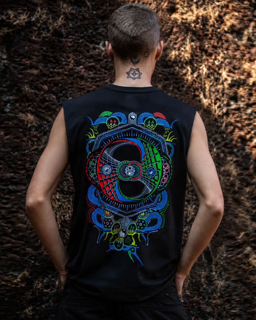 Damaru UV-reactive and glow-in-the-dark tank top back view worn by a model